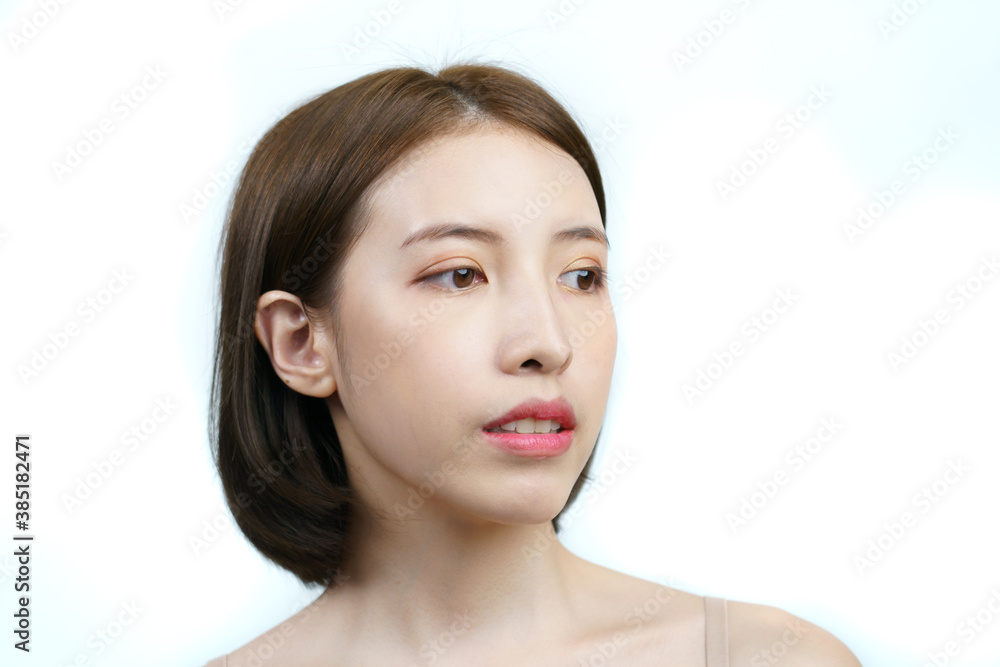 Asian woman face with healthy skin. Isolated on white background. Asian woman face with healthy skin. Isolated on white background.
