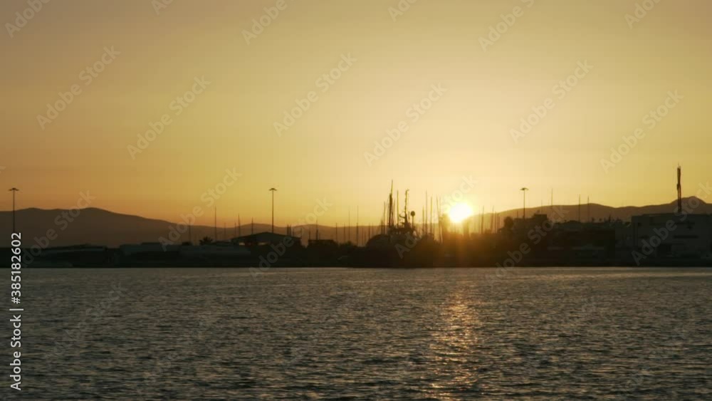 View of Kalamata port, during golden hour, with beautiful sunset, slow motion, wide . View of Kalamata port, during golden hour, with beautiful sunset, slow motion, wide .