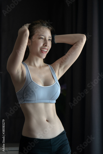 Sporty woman showing some strong abs and flat belly, Slim Body, Sport, Bodybuilding, Fitness Concept.
