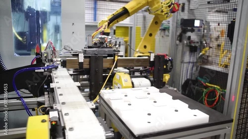 Fully automated double disk grinder making parts for the automotive industry at a manufacturing plant in Howell, Michigan. photo