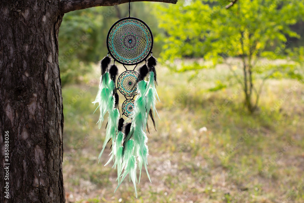 Handmade dream catcher with feathers threads and beads rope hanging Handmade dream catcher with feathers threads and beads rope hanging