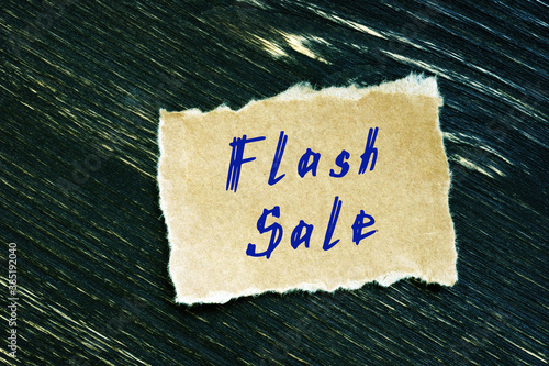 Business concept meaning Flash Sale with sign on the piece of paper.