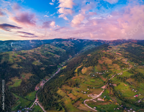 Beautiful rural area at sunset in the Apuseni mountains, Transylvania, Romania as seen from above with a drone. Aerial shot 