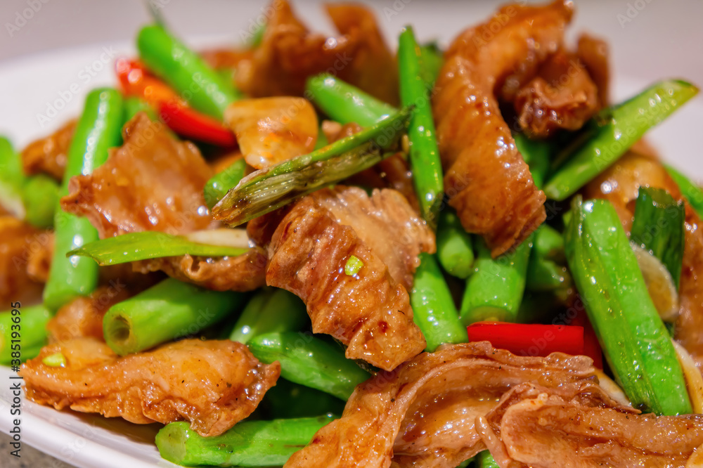 Close up shot of fried pork intestines with string bean Close up shot of fried pork intestines with string bean