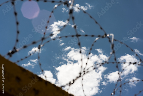 Barbed wire against the sky