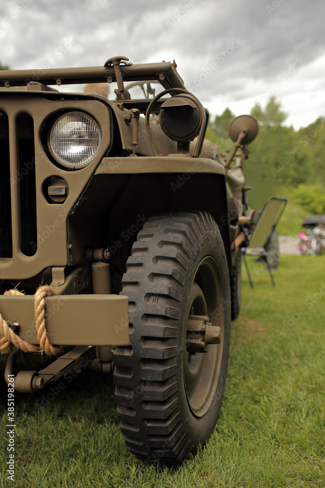 Fototapeta premium Close up of world war 2 jeep - wheel and headlight