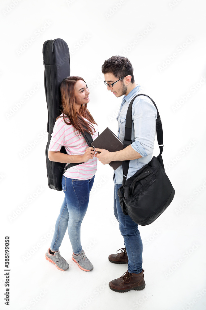 Yong south east Asian middle eastern Caucasian youth man woman in casual dress guitar case bag talk discuss book notebook on white background Yong south east Asian middle eastern Caucasian youth man woman in casual dress guitar case bag talk discuss book notebook on white background