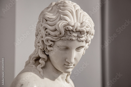 Ancient white marble sculpture head of young woman. Statue of sensual renaissance art era naked woman antique style © Ruslan Gilmanshin