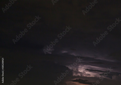 Picture of a flash in the night sky with glowing clouds