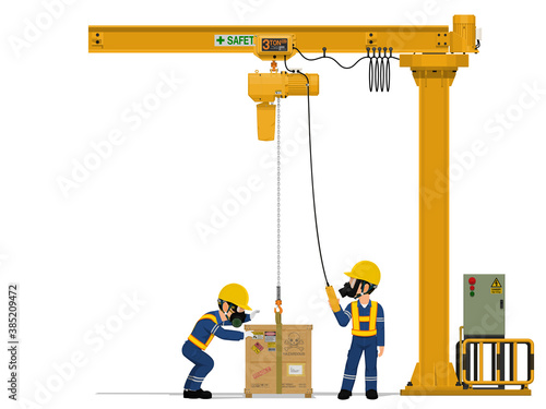 Two workers is lifting hazardous material by jib crane.