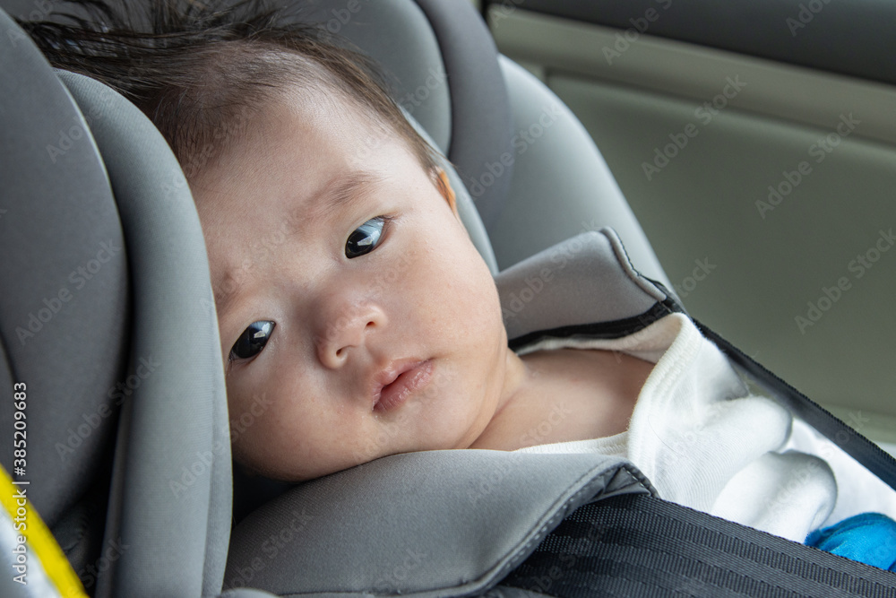 Local lifestyle Asian Chinese baby boy happy smiling white sit on child safety car seat Local lifestyle Asian Chinese baby boy happy smiling white sit on child safety car seat
