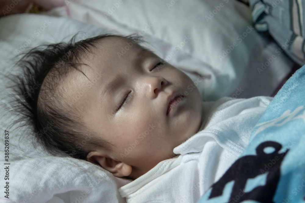 Little Asia Chinese child sleeping on bed at home Little Asia Chinese child sleeping on bed at home