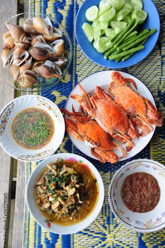 Thai seafood mix barbecue selection of crayfish, prawns and crab in local port restaurant. Traditional thai seafood cuisine made of fresh ingredients.