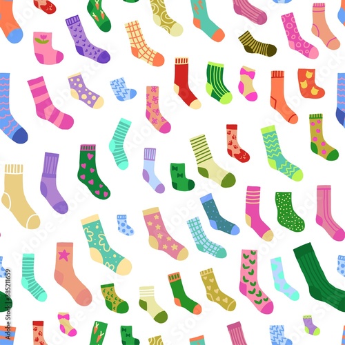 Seamless pattern with doodle socks of different texture and color. Winter trendy clothing items background