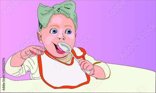 Bebé con cuchara en la mano