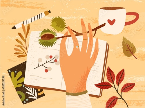 Cozy autumn composition with hand holding branch with chestnut, fall leaves, berries, notebook, pen and a cup of hot beverage. Autumnal hygge atmosphere. Flat textured vector illustration
