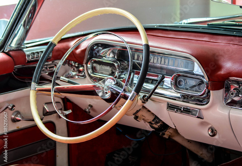 Steering wheel of a historic stylish American car © Petr