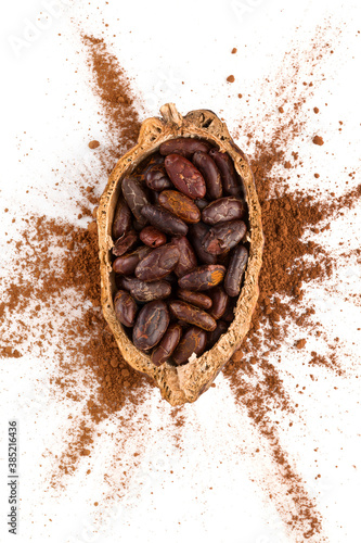 Fresh roasted cocoa beans on white background top view. © Eskymaks