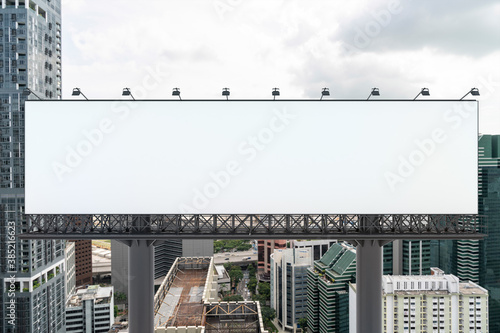 Blank white road billboard with Singapore cityscape background at day time. Street advertising poster, mock up, 3D rendering. Front view. The concept of marketing communication to promote.