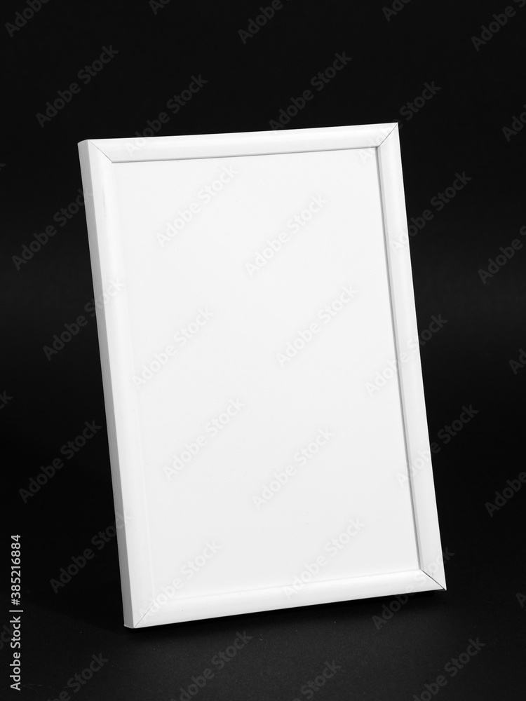 White frame stand on a black background, a blank for the design. Copy space.