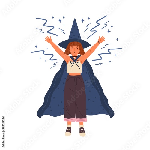 Cute girl in witch hat and cloak conjures. Young female wizard or sorcerer casts spell with raised hands. Young magician with red hair. Flat vector cartoon illustration isolated on white