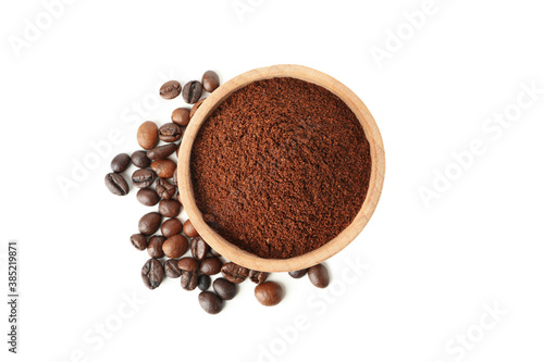 Wooden bowl with ground coffee isolated on white background