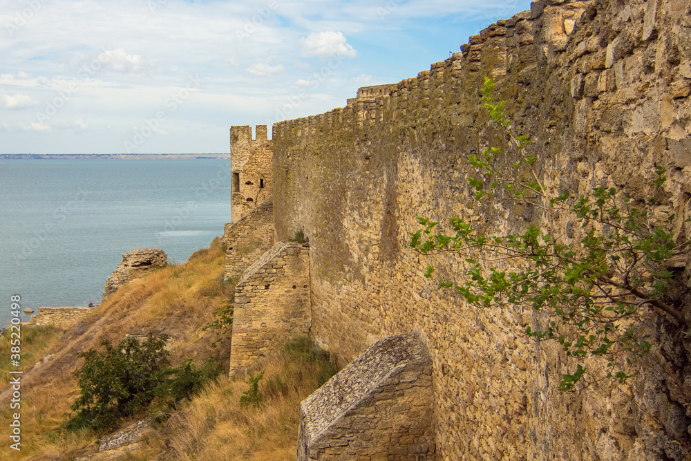 Panoramic view from the walls of Akkerman fortress (Bilhorod-Dnistrovskyi fortress) on the tower, defence walls and Black sea, Belgorod-Dniester city, Ukraine. Ukrainian landmark