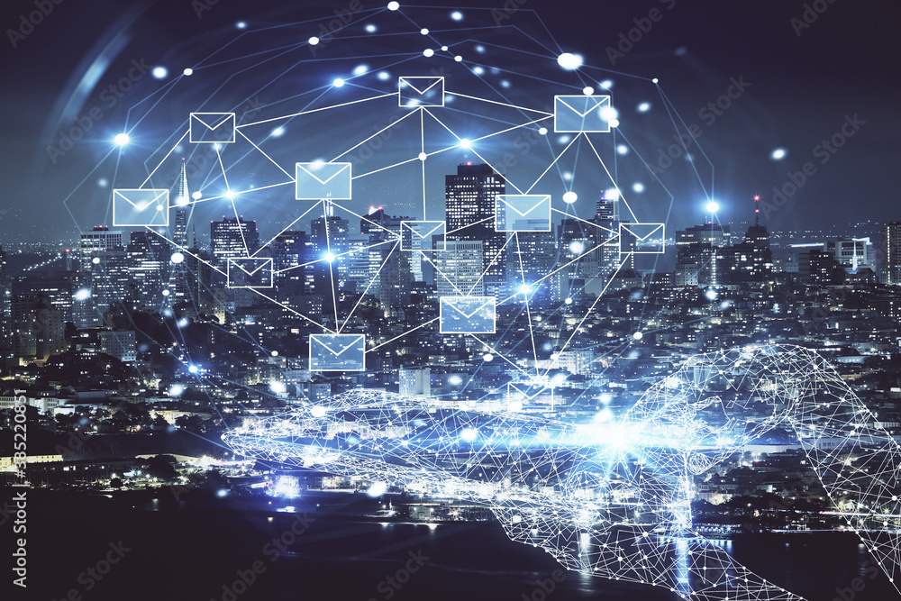 Double exposure of envelop hologram flying from gadget and city view background. Concept e-mail. Double exposure of envelop hologram flying from gadget and city view background. Concept e-mail.