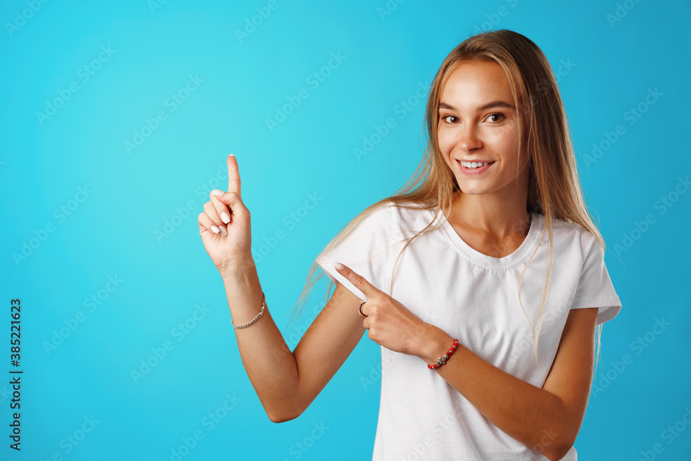 Portrait charming pretty cheerful girl showing copy space Portrait charming pretty cheerful girl showing copy space