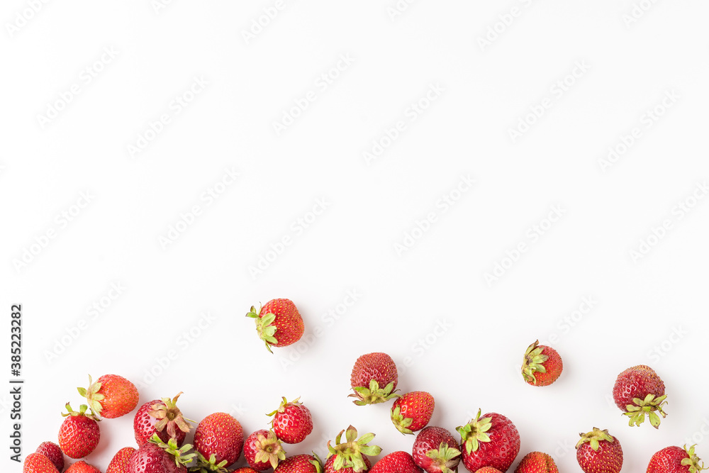 Overhead shot of fresh strawberries isolated on white background with copyspace Overhead shot of fresh strawberries isolated on white background with copyspace