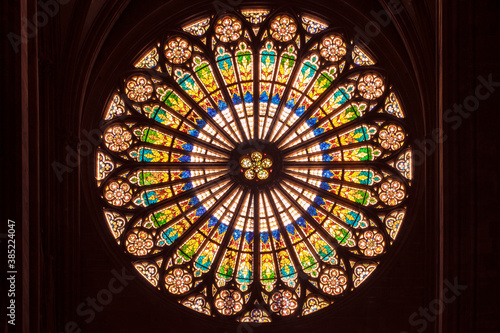 Rosette, huge beautiful stained glass window by the interior of notre dame cathedral in Strasbourg.