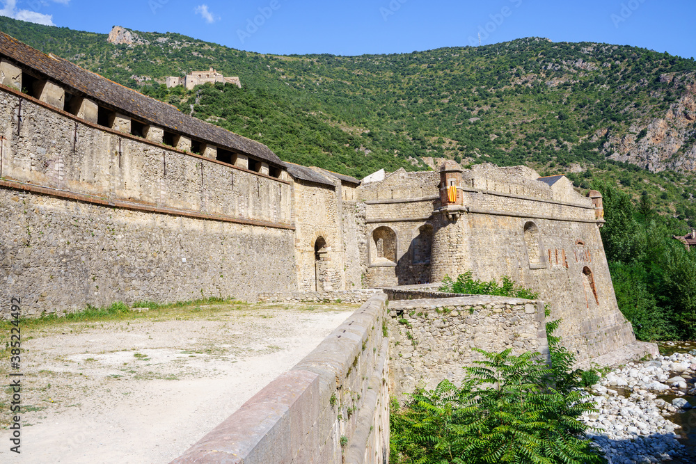 Walls of a medieval castle between mountains Walls of a medieval castle between mountains