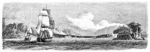 back view of ships sailing on little waved sea water towards Saint Nicholas Bay entrance, Chile. Ancient grey tone etching style art by De B�rard, published on Le Tour du Monde, Paris, 1861 photo