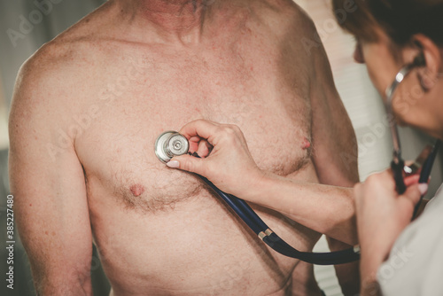 Konstfotografi Female doctor using stethoscope to exam patient