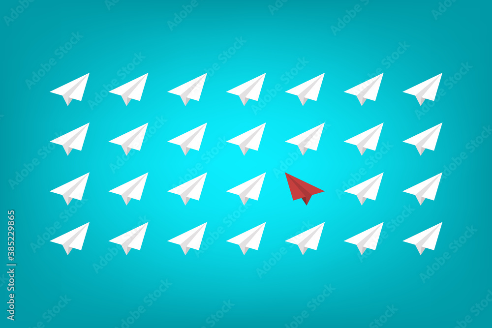 Think differently concept. Red airplane changing direction. New idea, change, trend, courage, creative solution, innovation and unique way concept. Think differently concept. Red airplane changing direction. New idea, change, trend, courage, creative solution, innovation and unique way concept.