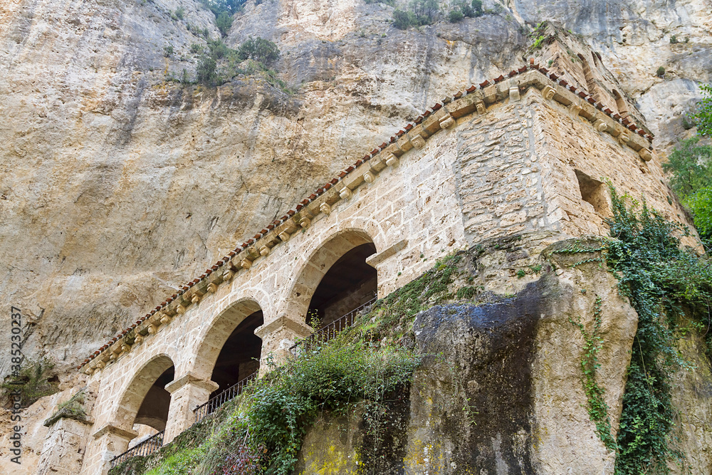 Fototapeta premium Tobera town romanesque singular church and waterfalls in Burgos province, Spain.