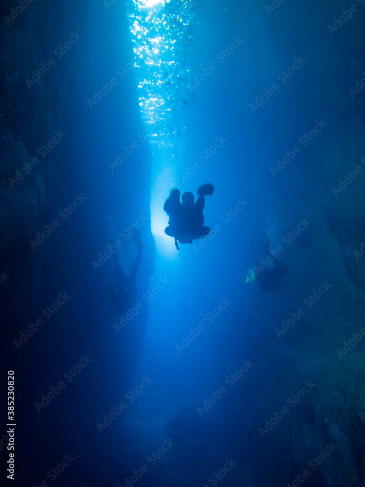 Divers in the canyon at the Inland Sea on the island of Gozo, Malta