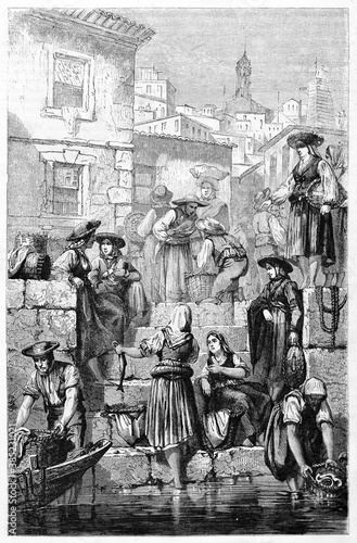 Old fish merchants downloading goods in a stone pier in Porto, Portugal. Ancient grey tone etching style art by L�fevre and Maurand, Le Tour du Monde, Paris, 1861