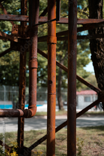Set of metals and pipes with rust in town. © Vuralshn