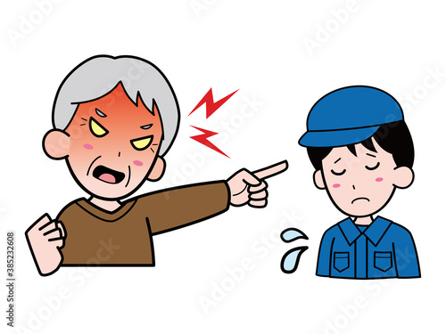 作業服姿の若い男性を怒鳴りつけるおじいさん