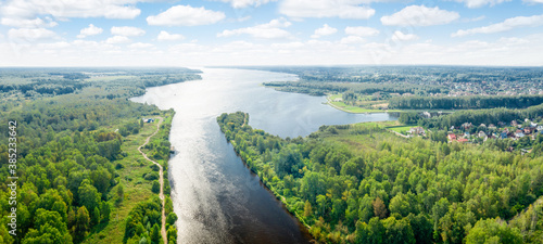 Top view of a water canal and reservoir on a summer evening