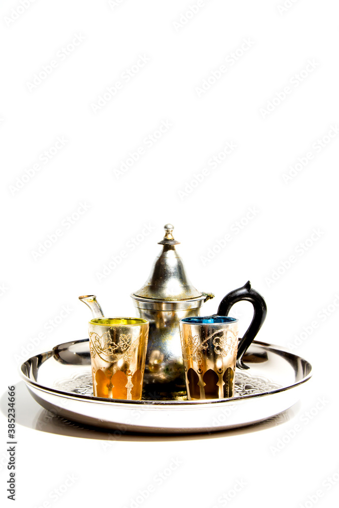 Group of teapot and glasses of oriental tea on a tray on white background Group of teapot and glasses of oriental tea on a tray on white background