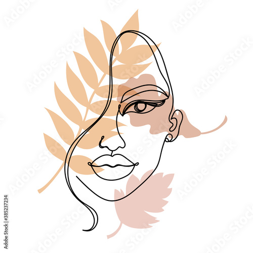 Continuous black line of a woman's face with colorful autumn leaves.