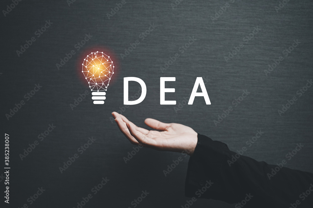 hand holding light bulb. idea concept with innovation and inspiration hand holding light bulb. idea concept with innovation and inspiration