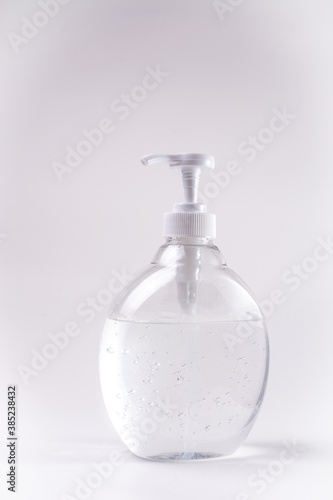 Bottle sanitizer gel alcohol desinfectant for hands vertical with neutral background withe 