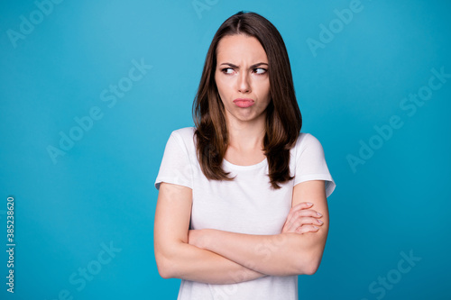 How could he. Photo of attractive lady hold arms hands crossed worker person bad mood boss fired her laid off look side offended wear casual white t-shirt isolated blue color background