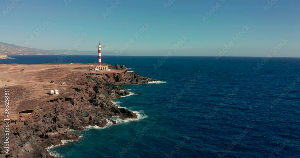 Aerial view. Lighthouse Faro de Rasca on Tenerife, Canary Islands, Spain. Wild Coast of the Atlantic Ocean. Aerial view. Lighthouse Faro de Rasca on Tenerife, Canary Islands, Spain. Wild Coast of the Atlantic Ocean.