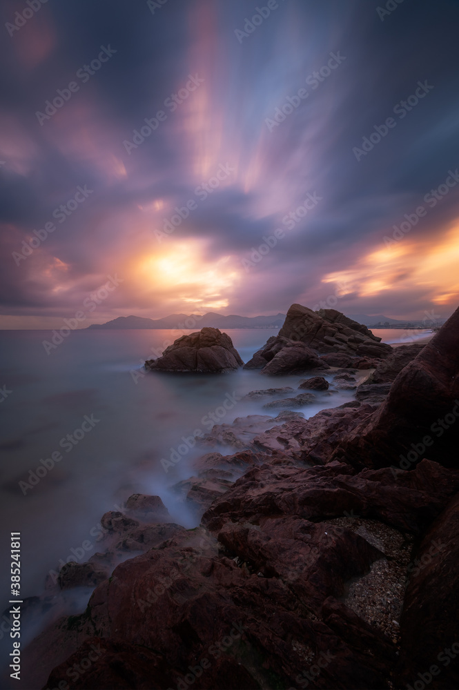Epic cloudy sunset above the coastline of Cannes