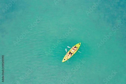 Top view of Happy Couple Kayaking in the Ocean on Vacation