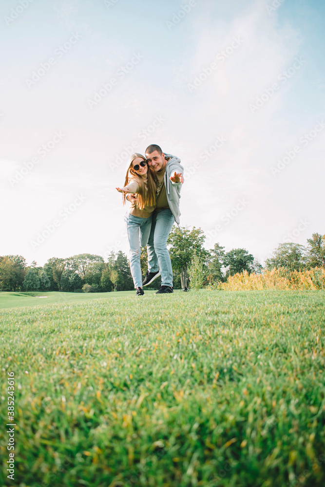 Young couple resting on the lawn Young couple resting on the lawn